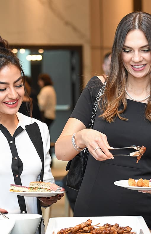 Attendees at an event serving food