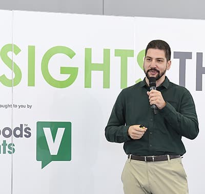 Speaker on stage at a vitafoods conference