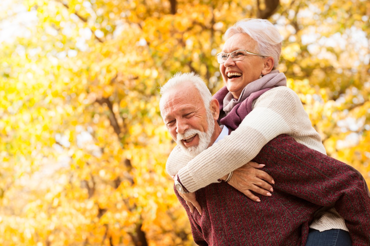 Portrait of healthy senior couple with toothy smile